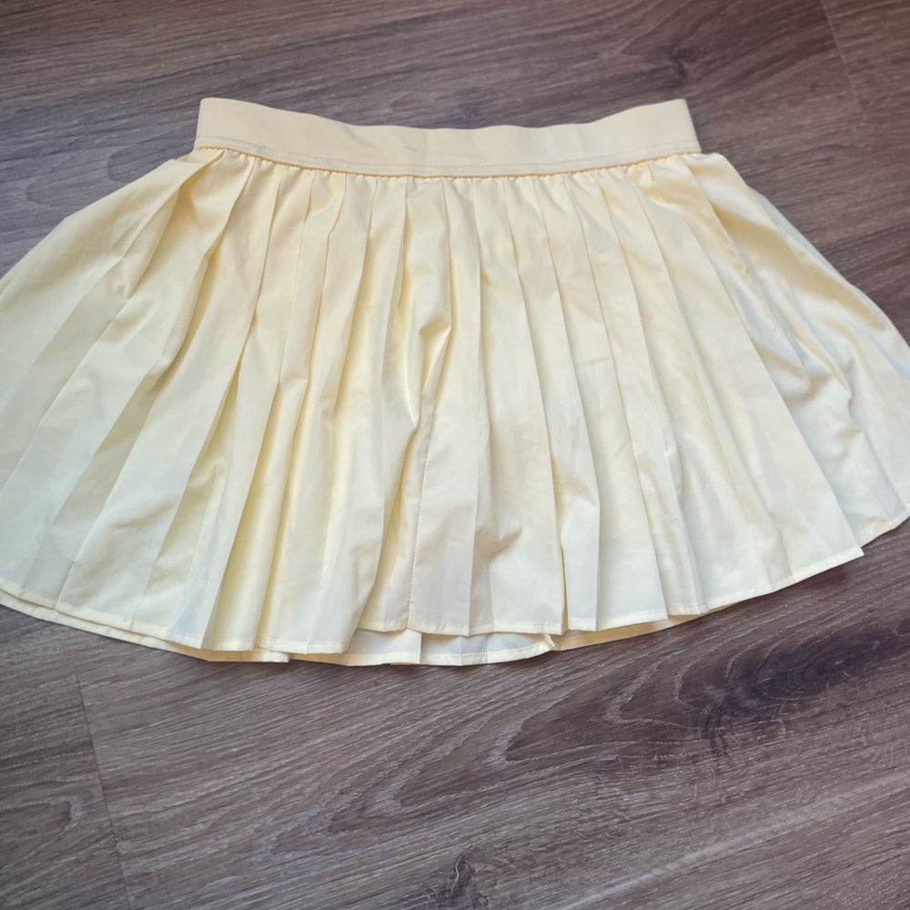 No Boundaries Pleated Yellow Mini Skirt